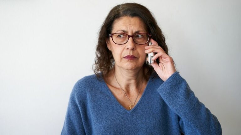 woman listening to scam call and needing debt attorney advice