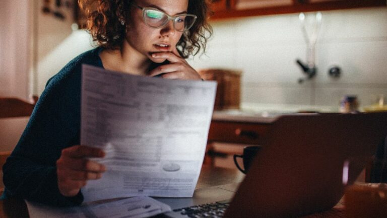 woman reading information from bankruptcy lawyer