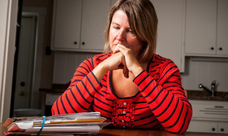 overwhelmed woman needing debt lawyer for bankruptcy