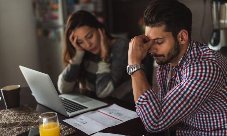 stressed out couple needing to talk to attorney about credit card debt
