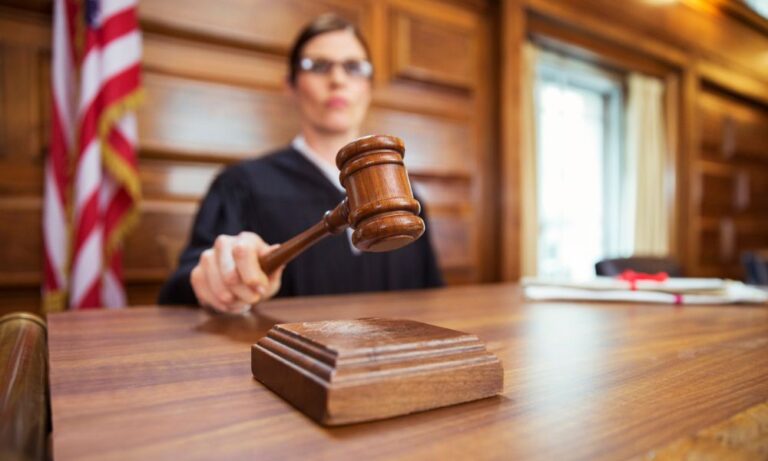 judge banging gavel to dismiss lawsuit due to debt lawyer